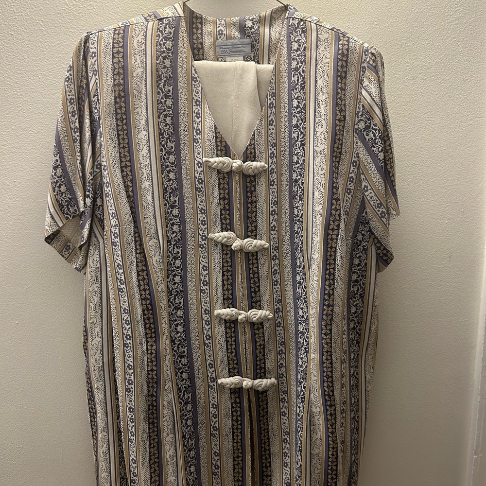 1980s set, patterned blouse paired with tan pants. In great shape for its age